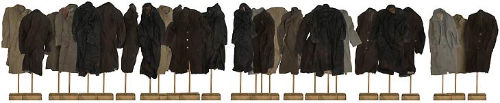 fig.: 'Showroom' by Goran Despotovski, 2004. The coats of the installation 'Showroom' are arranged like on a runway. The objects are equipped with a music mechanism providing sounds of situations that signify important stages in life such as birthday or wedding. The artist represents with the coats the moments of the absent human body and individual life. They look as if the former wearer had been interrupt during social interaction. 