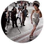 By the end of July 2009, the first 'behind the scenes images' from the Campari Calendar 2010 shooting have been published showing Bond-girl Olga Kurylenko in front of the camera of photographer Simone Nervi on the fashionable streets of Milan. 