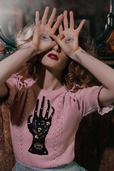 Image: Knitted top with hand (created by artist Kelly Louise Judd) from the 'Season of the Witch' Spring/Summer 2020 collection by Lena Hoschek. Photo: © Lupi Spuma.