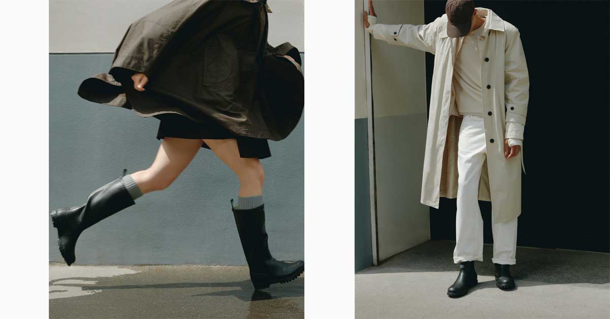 Woman running in knee-high black Superga rubber boots; man in light trench coat wearing black Superga ankle boots, standing casually.