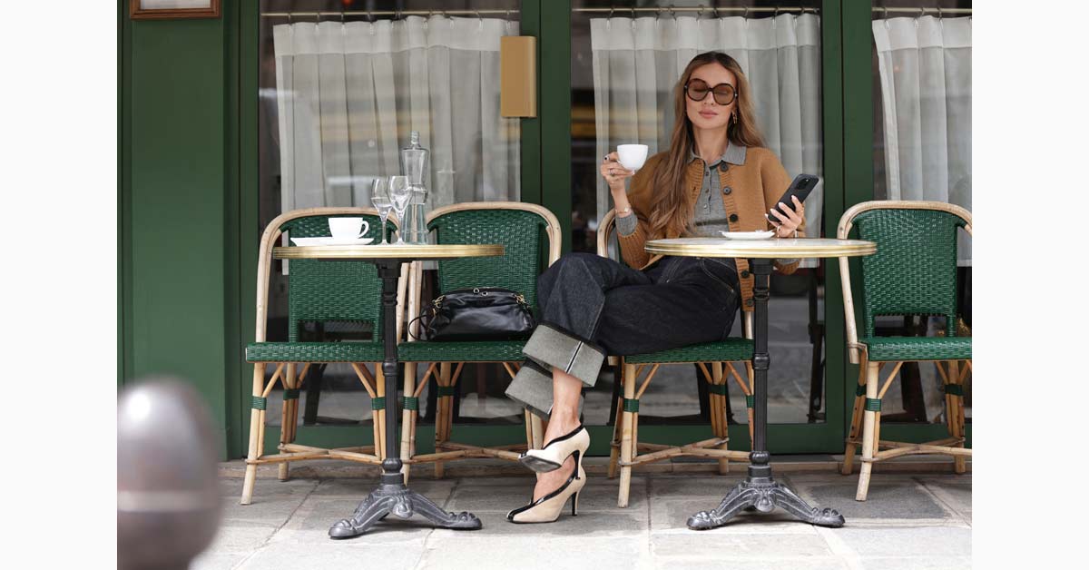 Viky Rader wearing the Style Icon Collection at a Paris café.