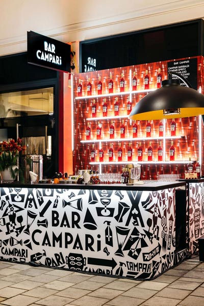 The image shows the bar outside of the 'Bar Campari' at the winter garden at Tuchlaubenhof in Vienna.