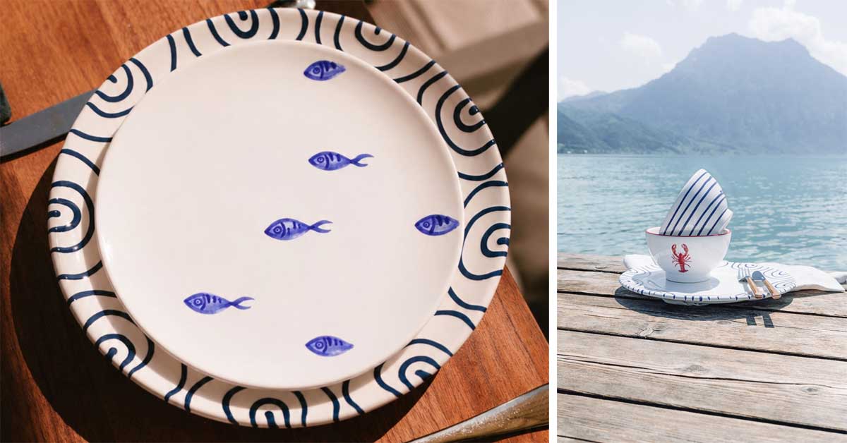 Blue School of Fish ceramic plate and lakeside table setting by Lake Traunsee from Gmundner Keramik's 2026 collection.