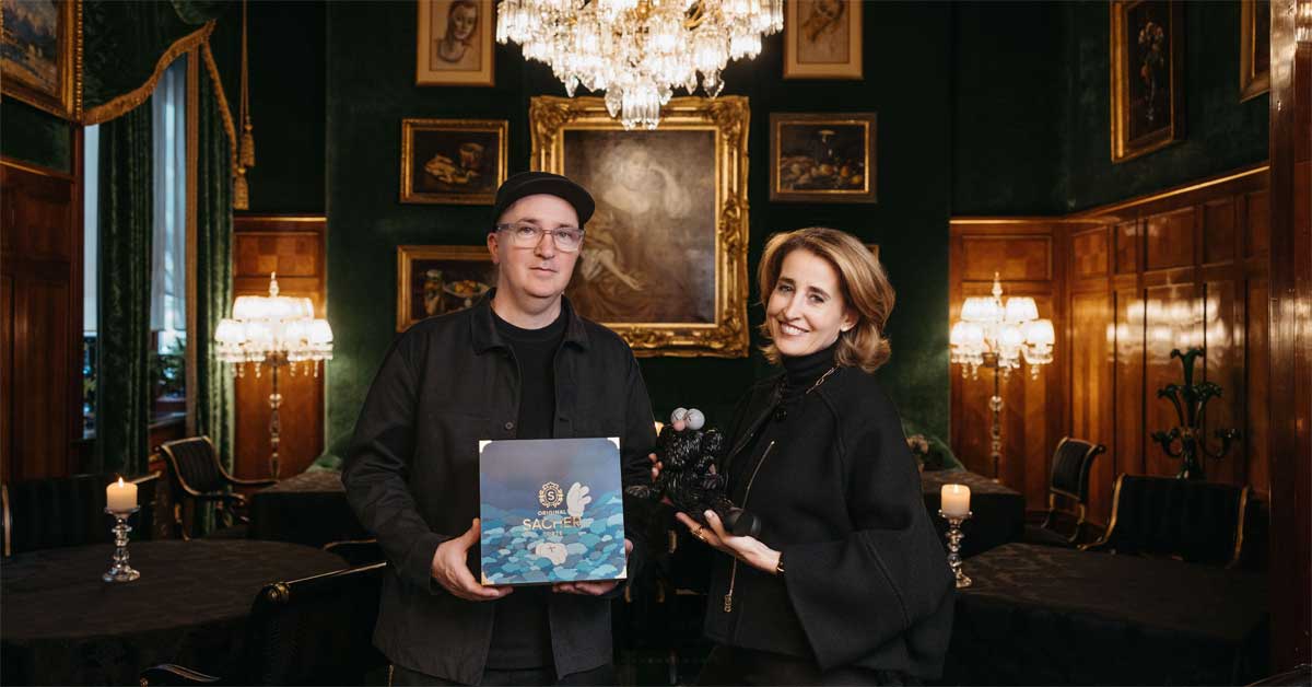 Artist KAWS and Sacher co-owner Alexandra Winkler presenting the 2026 Sacher Artists' Collection in Vienna.