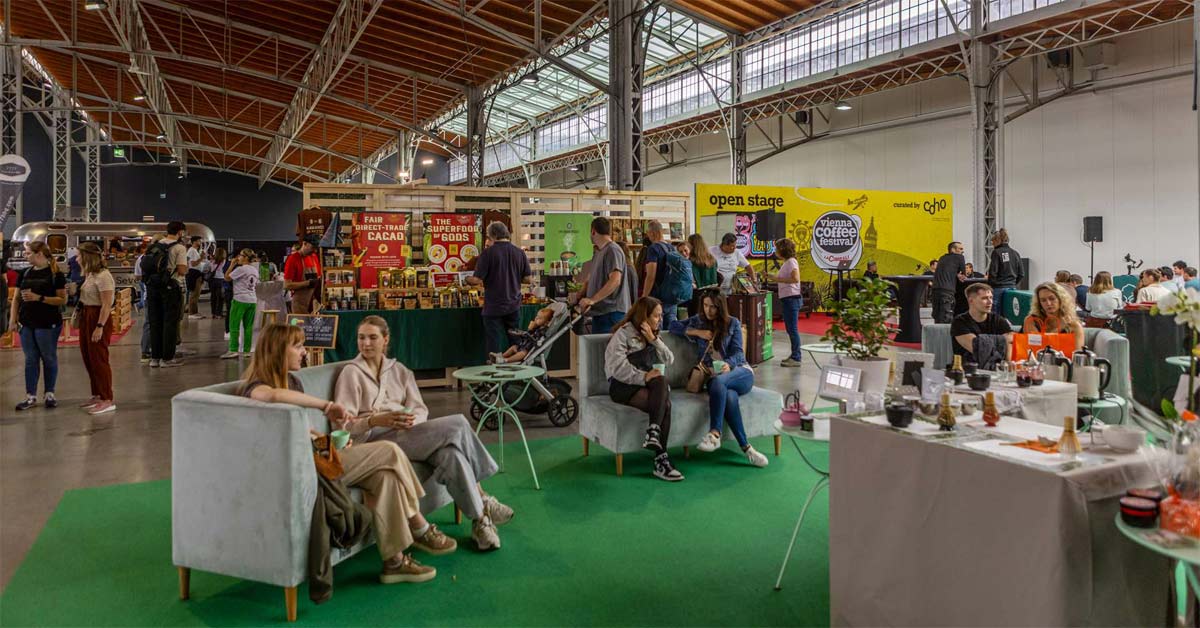 Visitors at coffee stands and seating areas during the Vienna Coffee Festival in Vienna's Marx Halle.