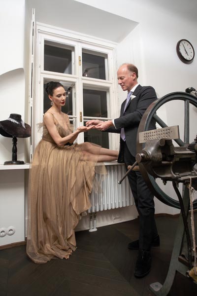 The image shows soloist Ludmila Konovalova and Wolfgang Koechert at the workshop at the headquarters of A. E. Köchert in Vienna. 