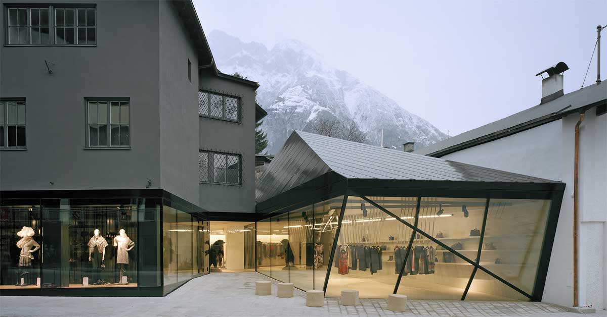 View of the new Telfs store of Emerson Renaldi and surrounding Alpine landscape.