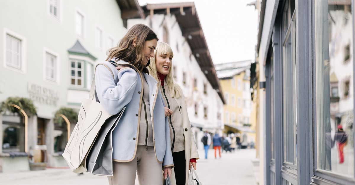 Two women walking through Kitzbühel’s old town.