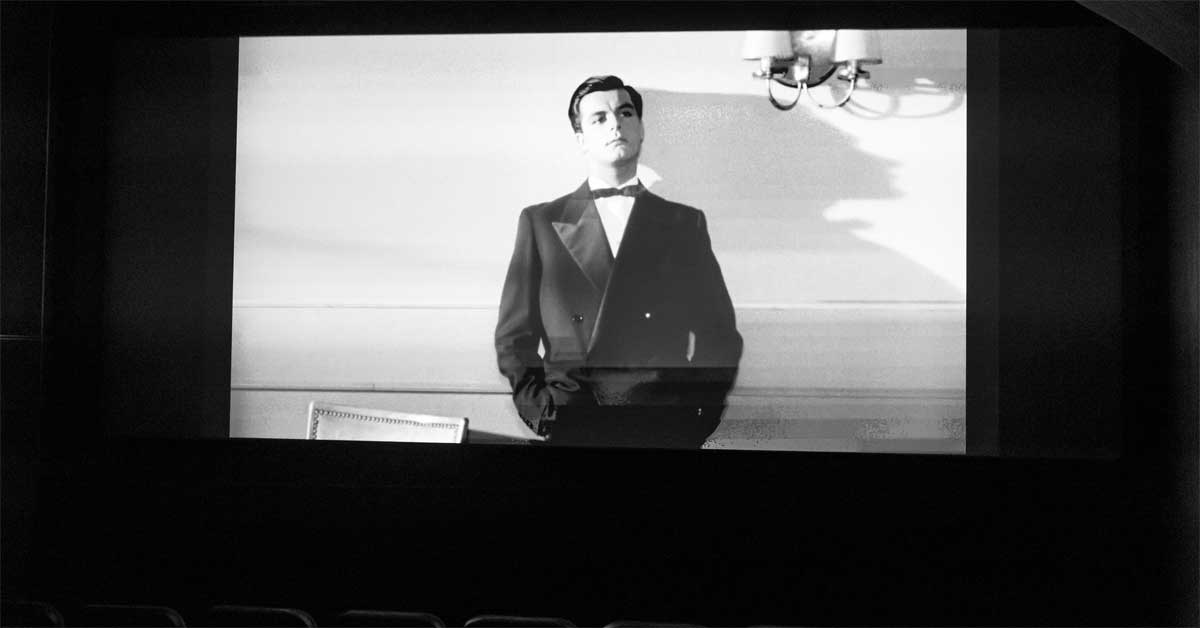 Black-and-white scene from the documentary 'Toni Sailer – Spuren einer Legende' projected in a cinema during the press screening in Vienna.