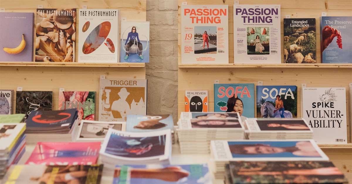 Art books and independent magazines displayed on shelves at Fanzineist Vienna Art Book and Zine Fair