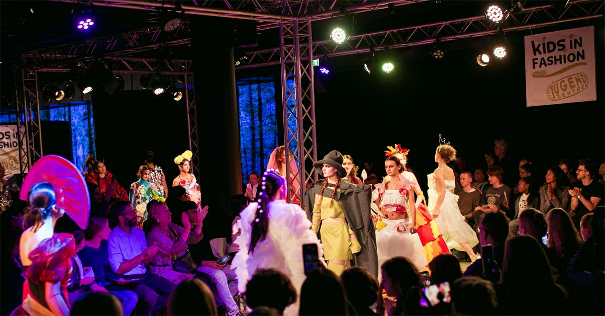 Young models present colourful Kids in Fashion designs on a Vienna runway.