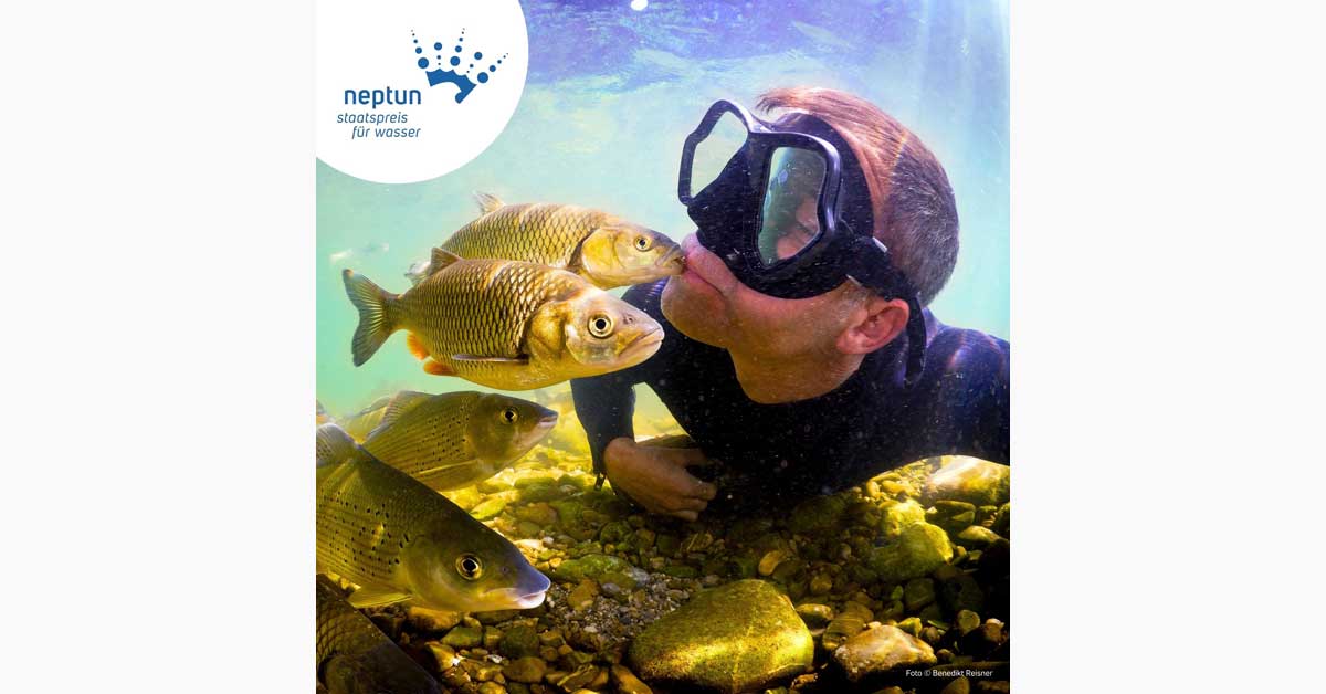 Diver underwater surrounded by fish in the campaign image for the Neptun State Prize for Water 2027.