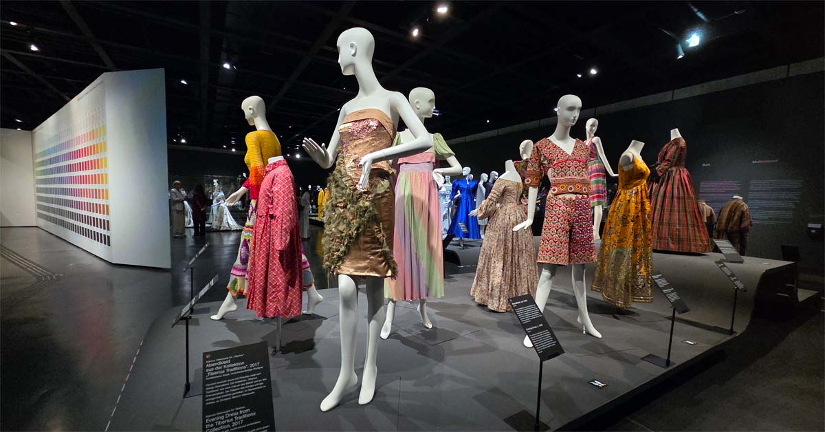 Wien Museum exhibition with colorful historic and contemporary garments on mannequins