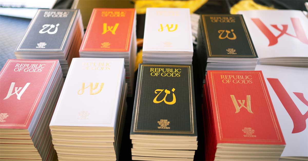 Stacks of Vienna Festival 2026 programme books displayed at a press conference in Vienna.