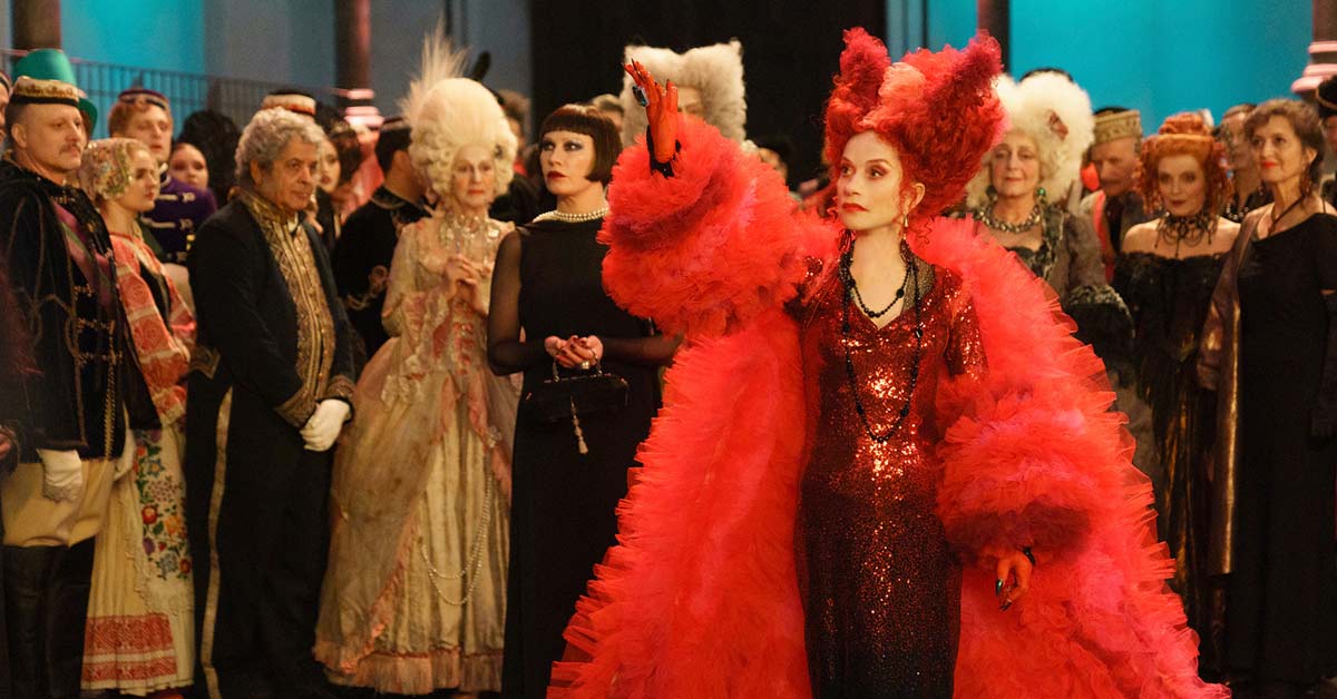 Isabelle Huppert in a red gown with Birgit Minichmayr in a black dress in The Blood Countess.