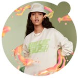 The image shows a model wearing a beige sweater dress and cap, both with 'Billie Eilish' logo. The model is surrounded by graphics designed by Paris-based artist Ines Alpha...